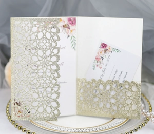 Elegant gold glitter laser cut wedding invitation set with floral RSVP card details