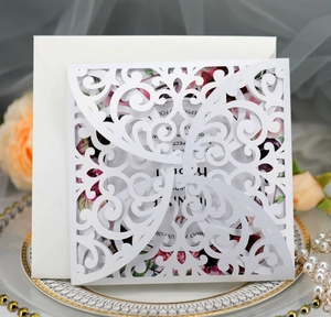 Laser-cut rose wedding invitation on decorative plate with pearls and flowers