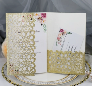 Elegant laser-cut gold glitter wedding invitation set with floral inner card and RSVP card