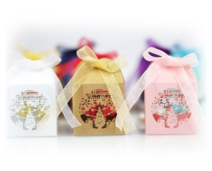 Detailed laser-cut Merry Christmas gift boxes with festive patterns and ribbon bows