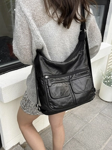 Versatile black large hobo bag in soft leather for women featuring multi-zipper pockets