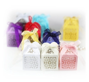 Laser-cut hollow candy gift boxes with elegant ribbons in multiple colors for weddings