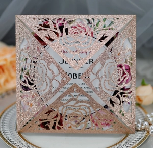 Detailed laser-cut rose gold glitter wedding invitation with elegant floral insert card