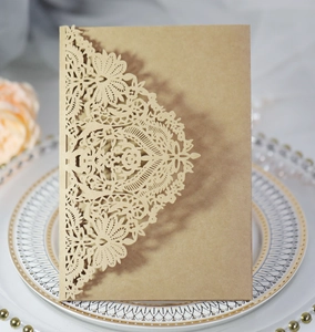 Detailed laser-cut kraft paper invitation with elegant floral hollow patterns for events