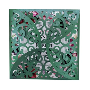 Elegant laser-cut dark green wedding invitation with floral insert and pearlescent finish