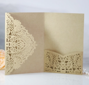 Macro detail of laser-cut lace mandala pattern on kraft paper wedding invitation cover