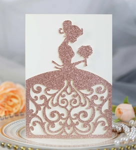 Detail of rose gold glitter wedding card with laser cut bride silhouette on elegant plate