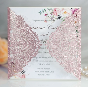 Detail of rose gold glitter laser-cut wedding invitation with elegant floral inner card