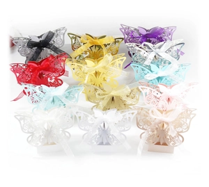 Detailed laser-cut butterfly gift boxes in various colors with ribbon bow closures