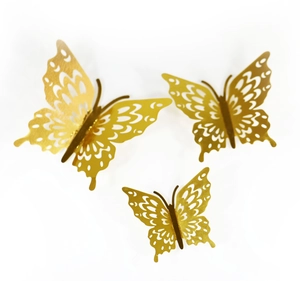 Detail of three-piece mirror gold butterfly wall stickers with intricate hollow patterns