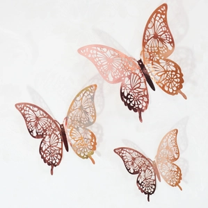 Detailed close-up of rose gold hollow 3D butterfly wall stickers with intricate laser-cut patterns