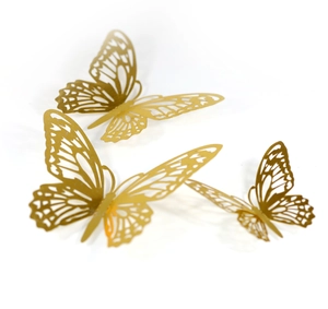 Detailed view of three 3D gold butterfly wall stickers with intricate hollow patterns