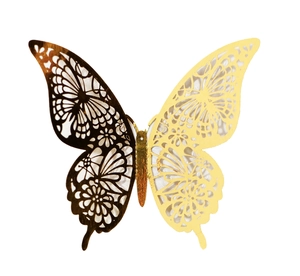 Detailed macro view of laser-cut 3D hollow butterfly with golden and black metallic finish