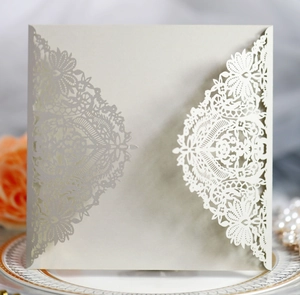 Detailed laser-cut lace invitation card with pearlescent finish and floral pattern