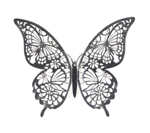 Close-up of a 3D hollow black butterfly wall sticker with intricate floral lace patterns