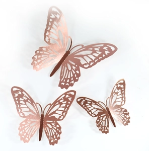 Detailed macro view of 3D hollow rose gold butterfly wall stickers with metallic texture
