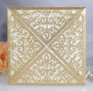 Detail showing golden glitter laser-cut floral pattern for square wedding invitations