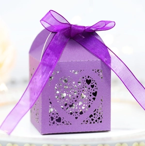Detailed laser-cut purple gift box with heart patterns and silk ribbon bow