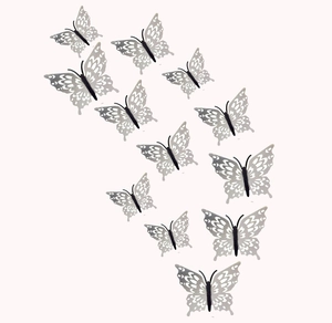Detail view of 12pcs silver 3D hollow butterfly wall stickers with intricate carved patterns