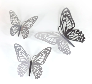Detail of 3D hollow butterfly wall stickers with intricate laser-cut wing patterns