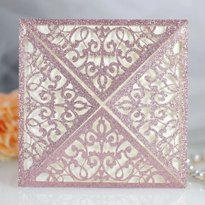 Detailed laser-cut square wedding invitation cover in rose gold glitter paper