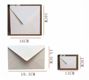 Three sizes of pearlescent white envelopes with V-flap design for invitations