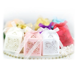 Elegant laser-cut favor boxes with silk ribbons for weddings and parties, multi-color set