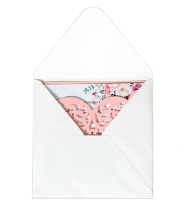 Detail of pink laser-cut lace invitation cover with watercolor floral wedding card