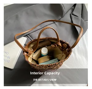 Internal capacity of leopard print bucket bag showing spacious storage for cosmetics