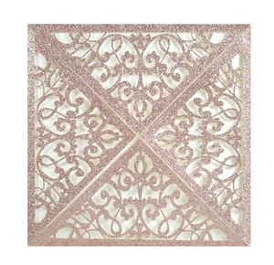 Detailed laser-cut hollow floral pattern on a rose gold glitter wedding invitation card