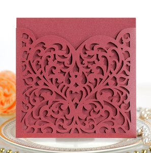 Detailed laser-cut heart scroll pattern on pearlescent burgundy square invitation cover