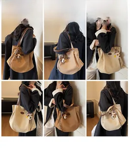Detail shots of large canvas tote bag with pleated texture and plush puppy charm