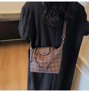 Brown checkered tote bag shown on model back view for size and daily style comparison