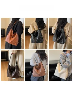 Detail view of retro tote bags in various colors showing soft texture and large capacity
