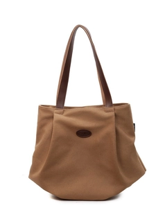 Brown canvas tote bag with leather handles and logo on white background