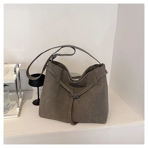 Detail view of large elephant grey matte leather tote bag with stylish buckle strap decoration