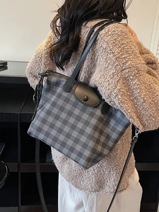Classic grey plaid tote bag with leather handles and crossbody strap for daily commute