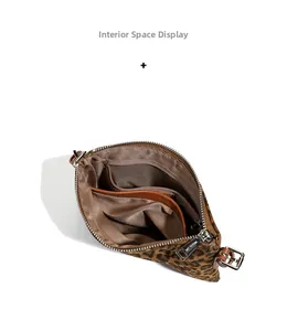 Interior view of leopard print crossbody bag showing pockets and lining