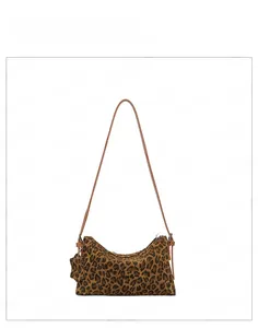 Detailed view of the brown leopard print pattern and star charm on the vintage shoulder bag