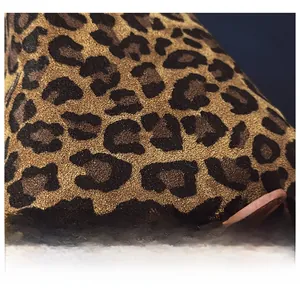 Close-up of premium leopard print fabric with matte frosted texture on the shoulder bag
