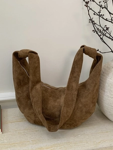 Vintage large dark brown suede crescent crossbody bag with stylish knot strap detail