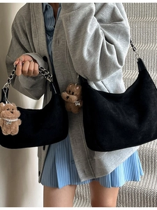 Retro black suede hobo bag with woven chain strap and plush dog charm for women