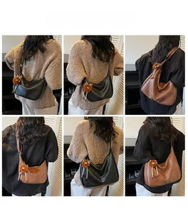Collage of model wearing vintage large capacity faux leather shoulder bags in black and brown