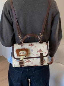 Sac bandoulière blanc à motifs de chiens de dessin animé et lanières en cuir marron