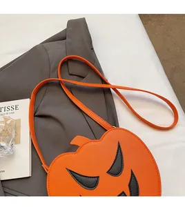 Detail of orange pumpkin crossbody bag with lychee texture PU material for Halloween