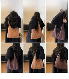 Detailed views of vintage faux suede hobo tote bag in brown and tan worn by a model