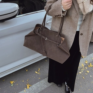 Detailed view of dark brown matte suede tote bag with elegant silver D-ring buckle