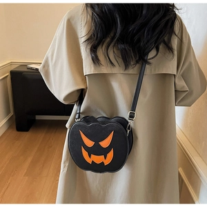 Back view of a model wearing the Halloween pumpkin crossbody bag with orange devil face
