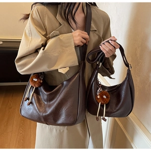 Comparison of two dark brown synthetic leather hobo bags in large and small sizes