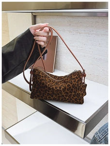 Classic leopard print baguette bag with brown leather strap and soft suede texture